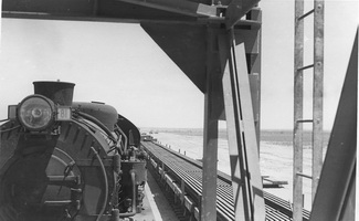 from 1.1953,Commonwealth Railways,Construction Stirling North to Marree - L81 front view alongside rail wagons